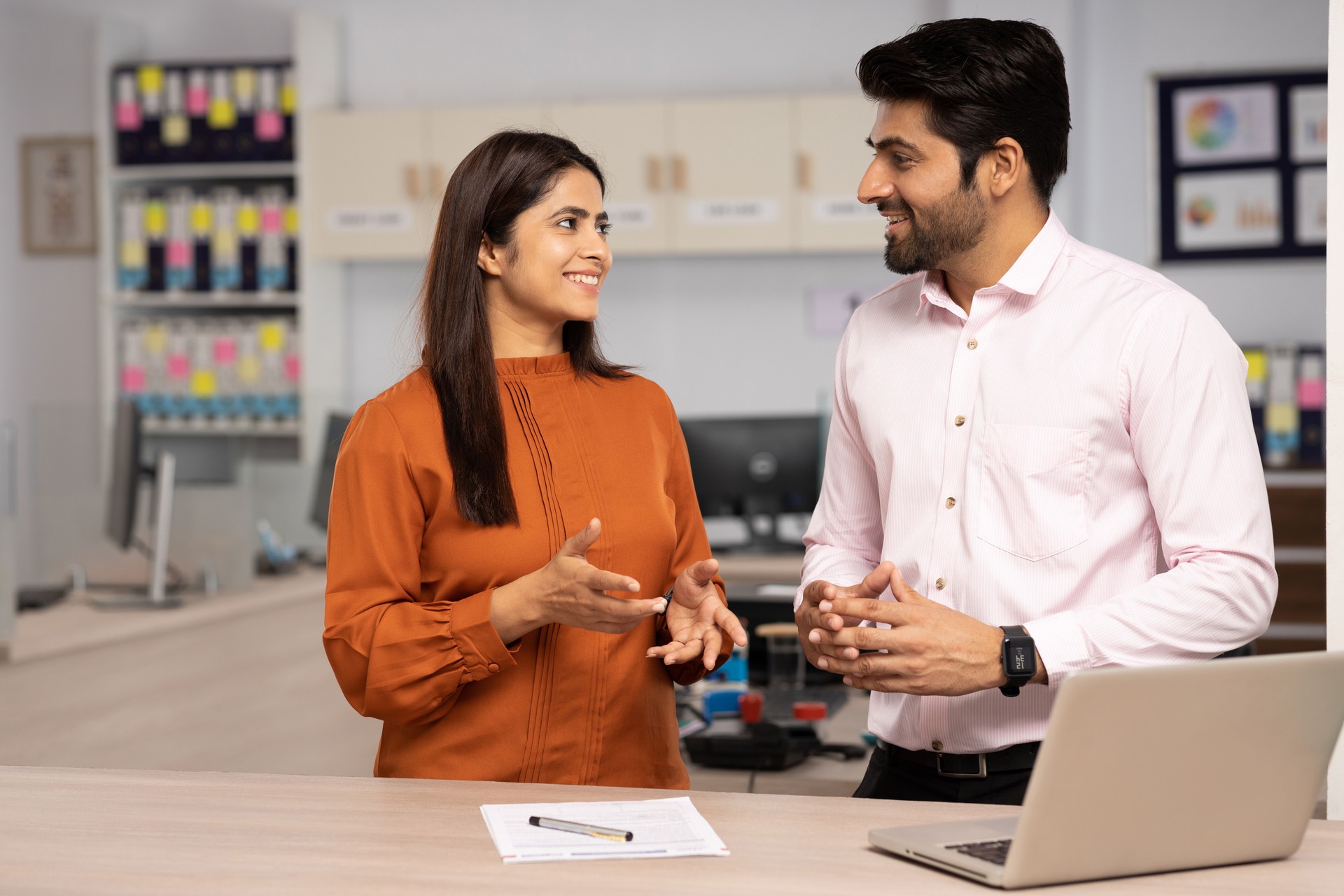 Two businesspeople discussing  in office. Stock photo